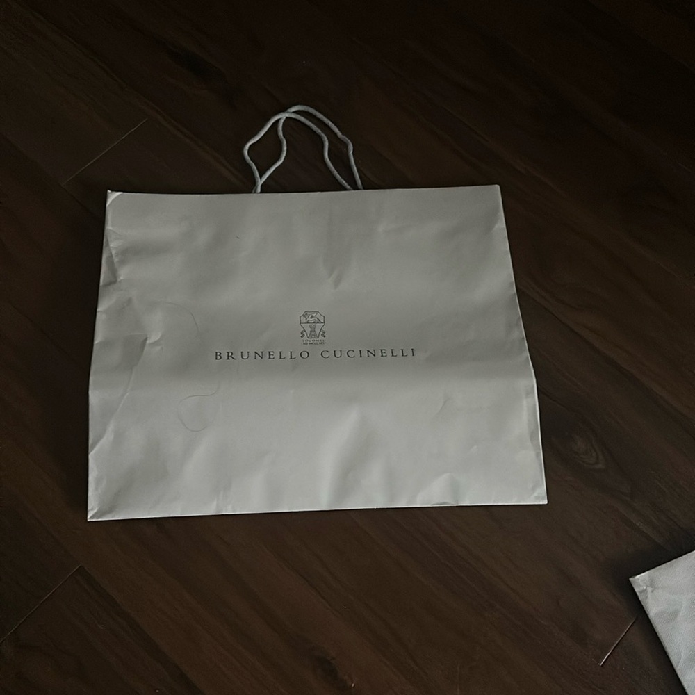 2 large paper bags, 1 ribbon, and small paper wrap with clear side and tie.